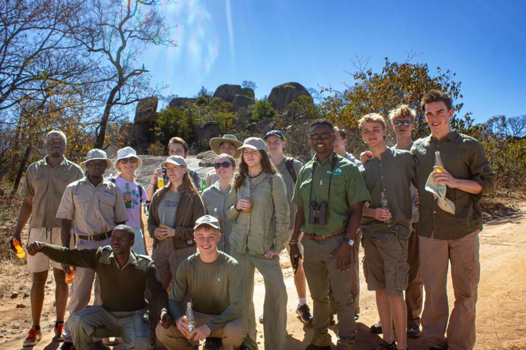 A safari group with a kopje behind them in Matobo National Park